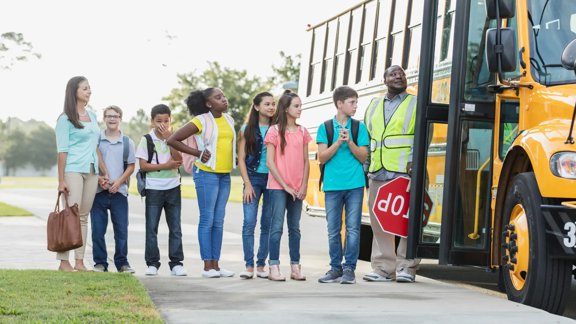 Parents waiting in extended car lines outside school, reflecting high-stakes time management problems
